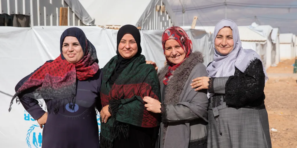 Four women apart of the Jordan Artisan Collective stand together