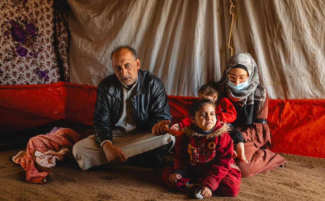 Jordan_Khaled-sitting-with-his-children