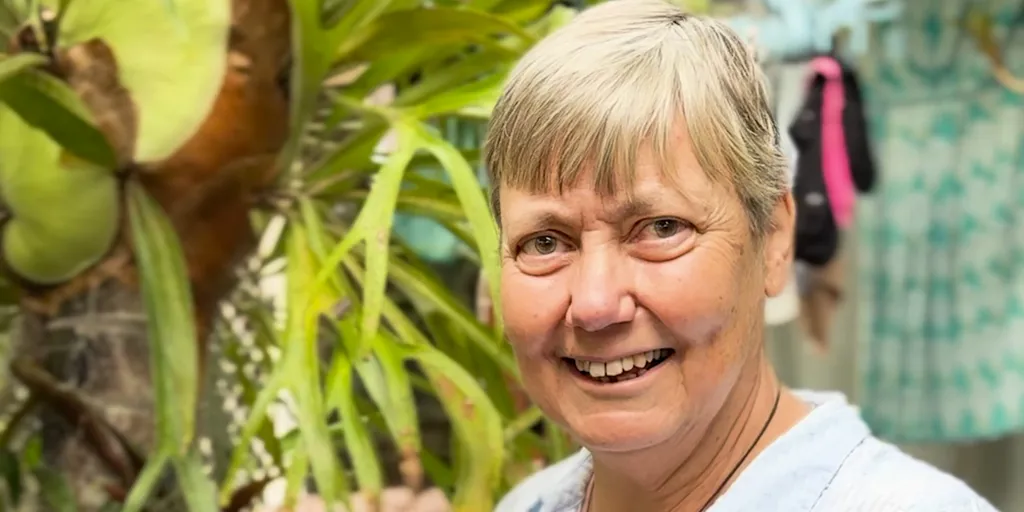 Ruth Carter in her garden, where she grows her own plants
