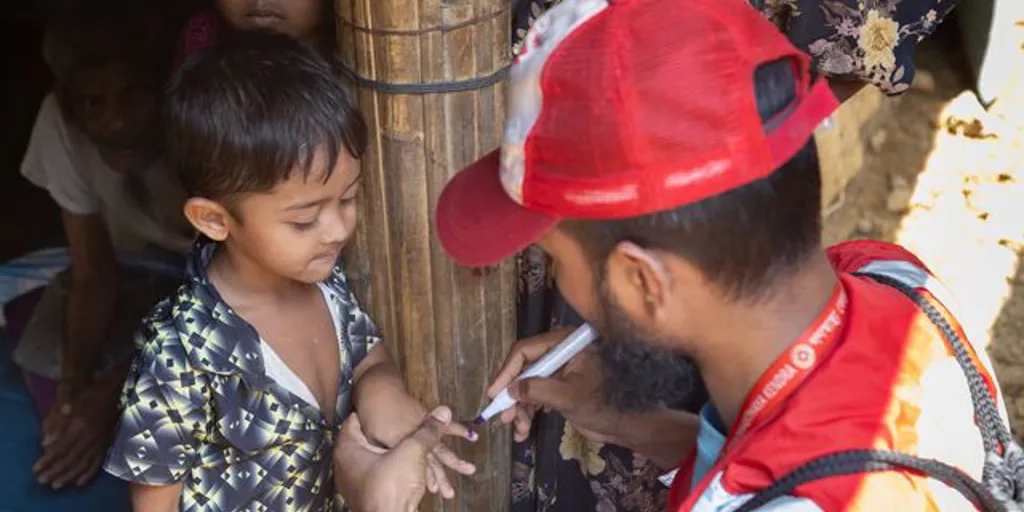 Small Bangladesh. Marking A Child's Finger After Having Administered A Dose Of Cholera Medicine