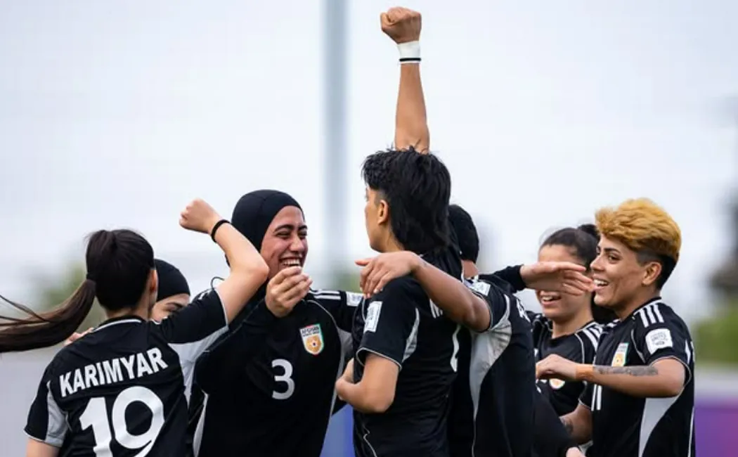 Afghanistan_Afghan Women United football team celebrate scoring a goal