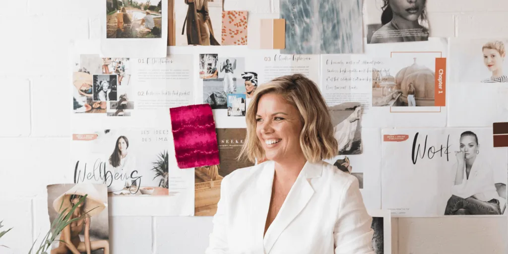Jess Mester, a Leading Women Fund member, stands at her desk.
